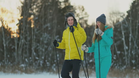 A-man-and-woman-cross-country-skiing-in-the-winter-forest